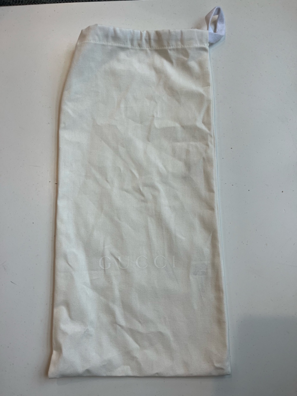 Gucci Cream Embossed Logo draw string Bag